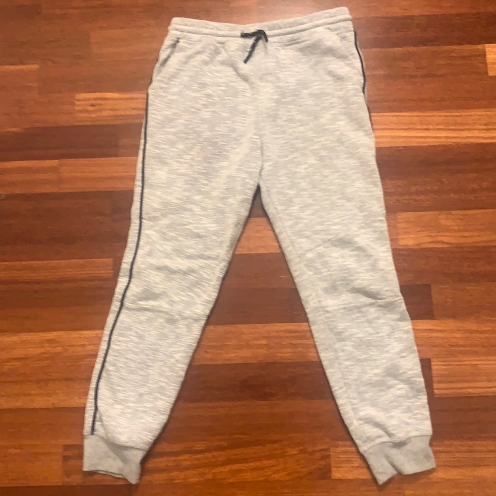 Boys Tilly’s gray joggers with black piping down the sides.  Size L